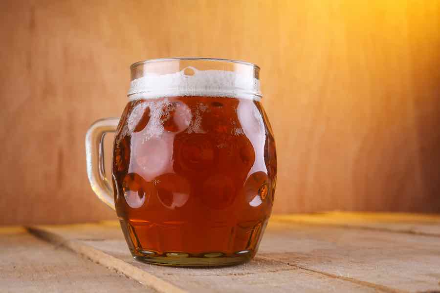 Dimpled beer mug with Maibock Beer