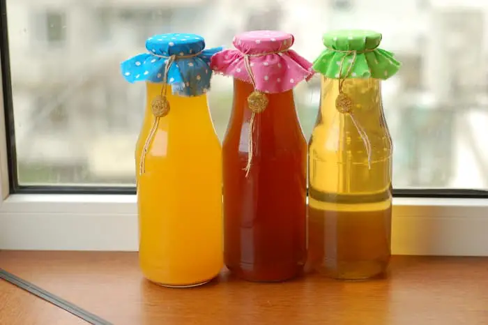 Bottles of homemade mead that illustrate how different mead can look.