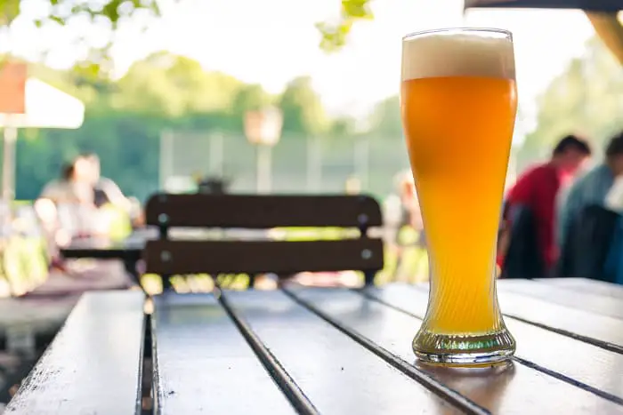 Glass of German beer on table -- Galaxy hops is used to make German wheat beers.