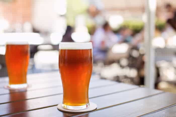 Amber colored beer in glasses.