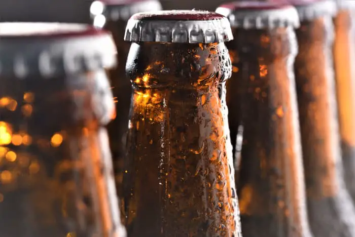 Closeup of brown beer bottles.