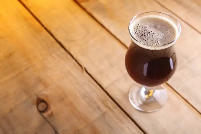 Goblet of dark colored beer resembling Scotch Ale.