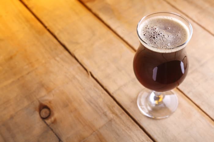 Goblet of dark colored beer resembling Scotch Ale.