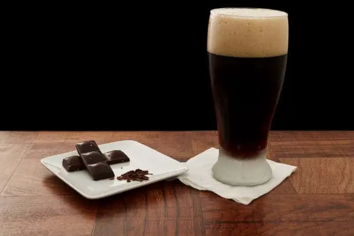 A dark beer and squares of dark chocolate.