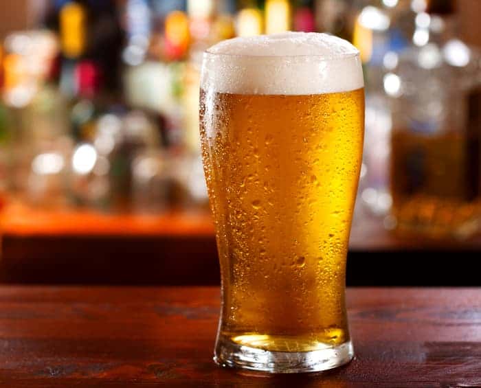A glass of light-colored beer resembling a Blonde ale beer.