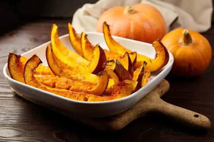 A dish of roasted pumpkin slices.
