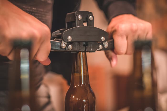 Man bottling beer.