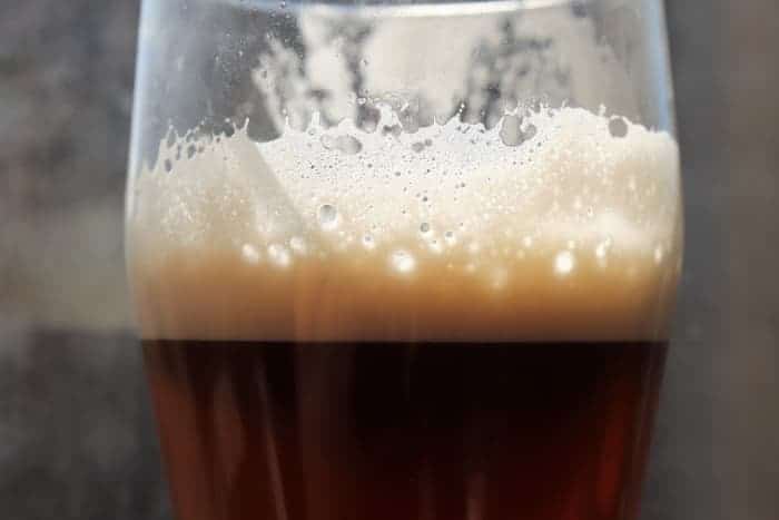 Closeup of a glass of Irish red beer.