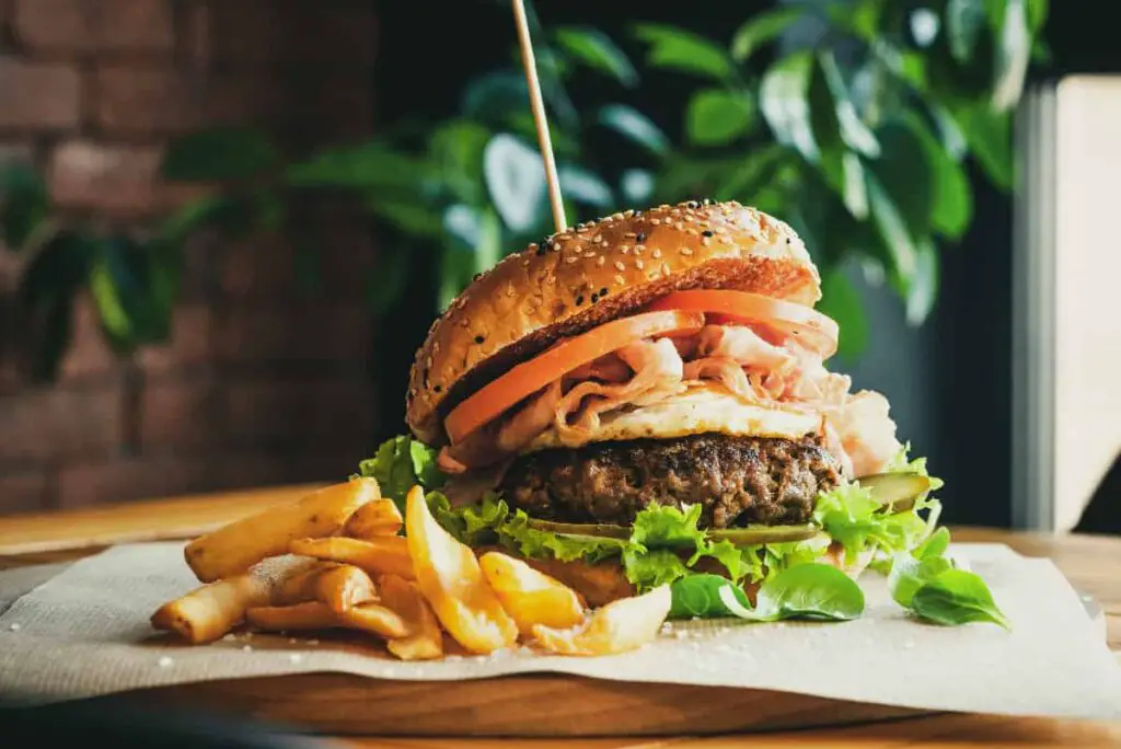 Closeup of a gourmet burger and fries.